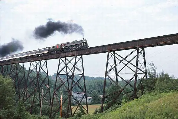 CNR 6060 crossing the Ste Ursule Falls Trestle in Quebec. This picture was taken and submitted by Massey F. Jones.